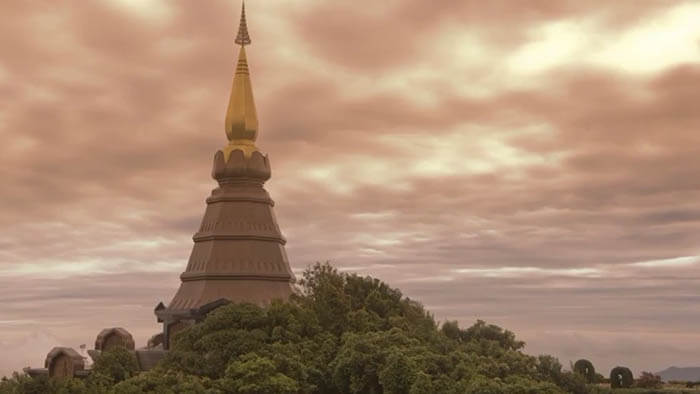 an old temple in a forrest on a cloudy day