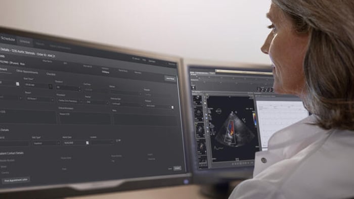 Clinician checking patient data on monitor